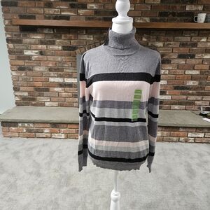 Cable knit turtleneck sweater.